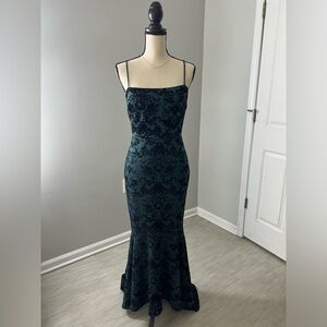 Hunter green floral velvet evening dress.
